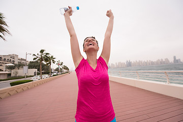 Image showing young woman celebrating a successful training run