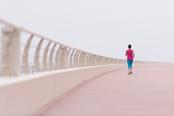 Image showing woman busy running on the promenade