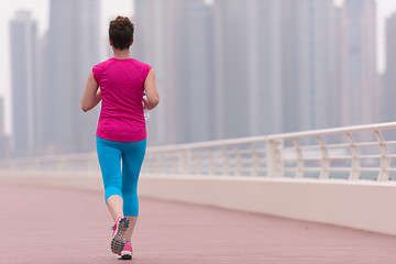 Image showing woman running on the promenade