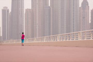 Image showing woman running on the promenade