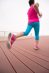 Image showing woman busy running on the promenade