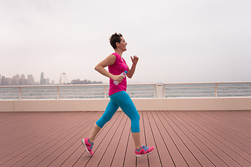 Image showing woman running on the promenade