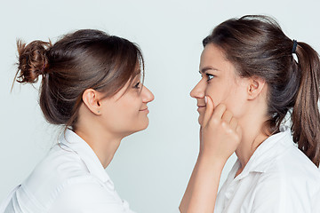 Image showing Studio portrait of female twins