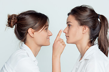 Image showing Studio portrait of female twins