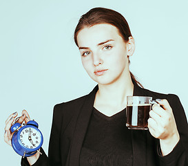 Image showing young beauty woman in business style costume waking up for work 