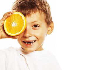 Image showing little cute boy with orange fruit double isolated on white smili