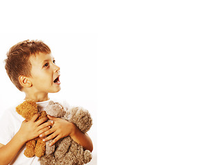 Image showing little cute boy with many teddy bears hugging isolated close up