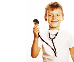 Image showing little cute boy with stethoscope playing like adult profession d