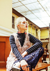 Image showing young attractive fashion lady on railway station waiting, vintag