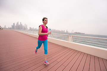 Image showing woman running on the promenade