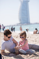 Image showing Mom and daughter on the beach