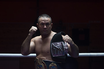 Image showing kick boxer with his championship belt