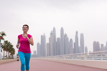 Image showing woman running on the promenade