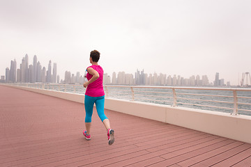 Image showing woman running on the promenade