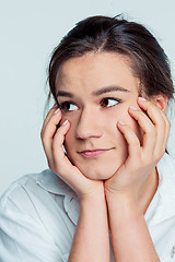 Image showing The young woman\'s portrait with thoughtful emotions