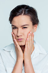 Image showing The young woman\'s portrait with thoughtful emotions