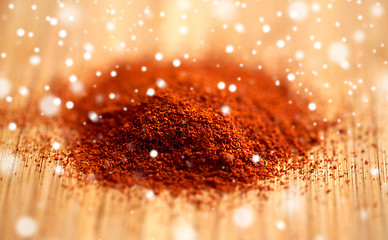 Image showing cayenne pepper or paprika powder on wood