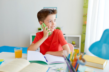 Image showing student boy calling on smartphone at home