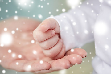 Image showing close up of mother and newborn baby hands