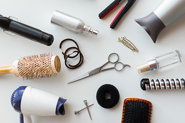 Image showing scissors, hairdryers, irons and brushes