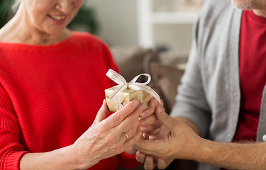 Image showing close up of senior couple with christmas gift