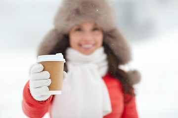 Image showing happy woman with coffee cup in winter