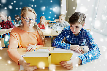 Image showing students reading book at school lesson