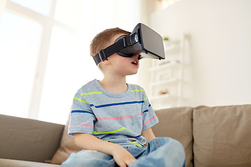 Image showing little boy in vr headset or 3d glasses at home