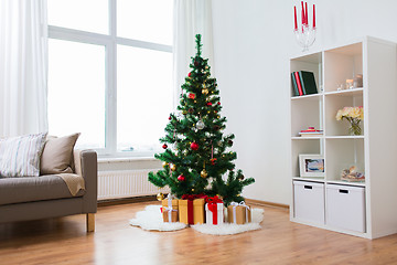 Image showing artificial christmas tree and presents at home