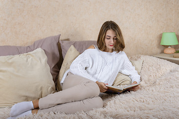 Image showing A girl with a book