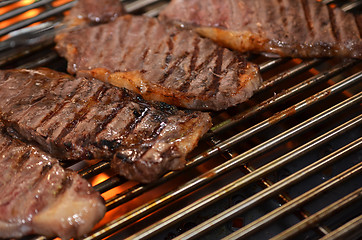 Image showing Beef steaks on the grill 