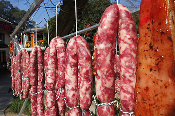 Image showing The meat drying outside on the sun