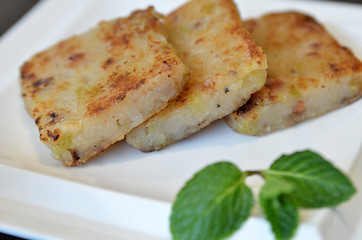 Image showing Fried carrot cake on white plate