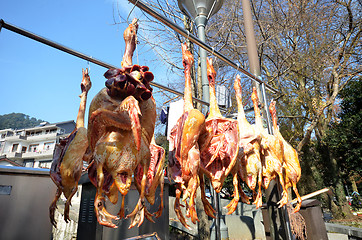 Image showing Rows of cured meat hanging to dry