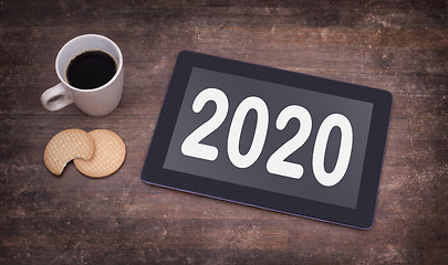 Image showing Tablet touch computer gadget on wooden table - 2020