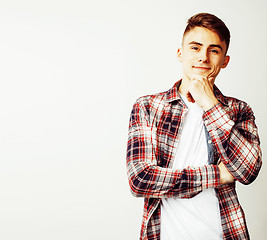 Image showing young handsome teenage hipster guy posing emotional, happy smiling against white background isolated, lifestyle people concept closeup