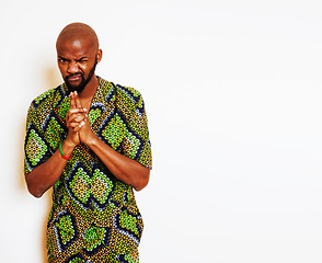 Image showing portrait of young handsome african man wearing bright green national costume smiling gesturing, entertainment stuff 