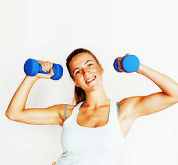 Image showing young pretty slim blond woman with dumbbell isolated cheerful sm