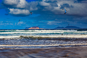 Image showing Surfers and kiters in the water on Famara beach, Lanzarote