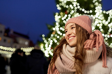 Image showing happy young woman at christmas market in winter