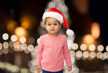 Image showing little baby girl in santa hat at christmas