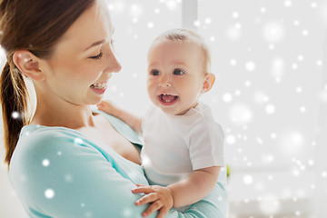 Image showing happy young mother with little baby