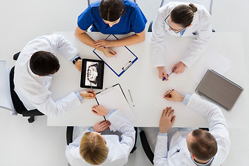 Image showing doctors with jaw x-ray on tablet pc at clinic