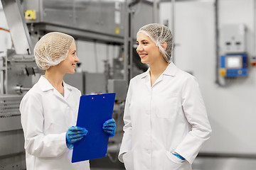 Image showing happy women technologists at ice cream factory