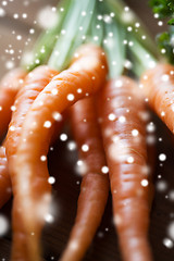 Image showing close up of carrot bunch on wooden table