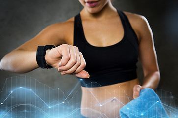 Image showing woman with heart-rate watch in gym