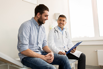 Image showing smiling doctor and young man meeting at hospital