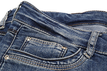 Image showing Fragment of dark blue jeans on white background