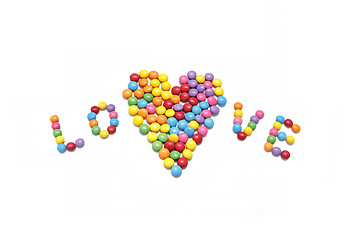Image showing Word ''Love'' and abstract heart from bright colorful candy
