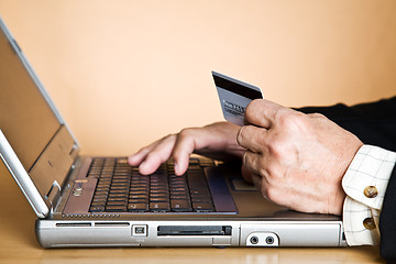 Image showing Senior businessman buying online